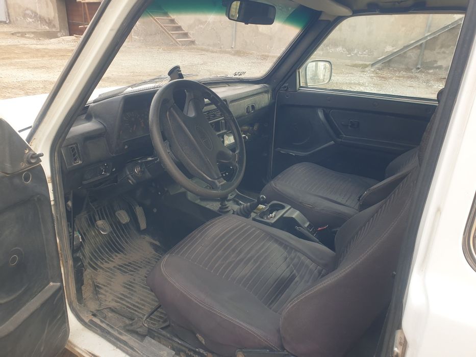 Урганчда НИВА ( Lada 4x4)автомашинаси сотилади.