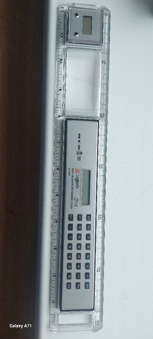 Riglă veche, cu ceas şi calcularor