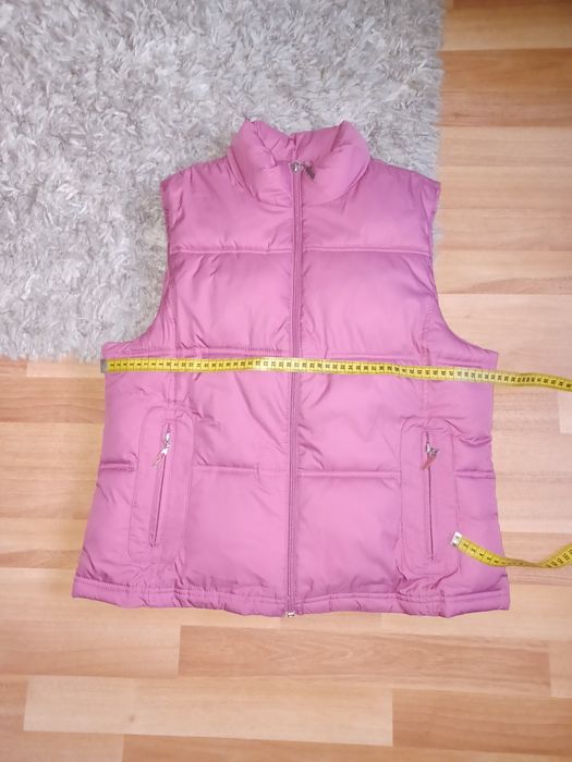Vestă          .