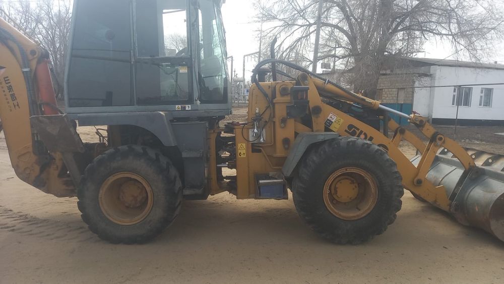 Услуги экскаватор-погрузчика