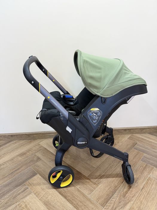 Doona автокресло коляска. Зеленого цвета