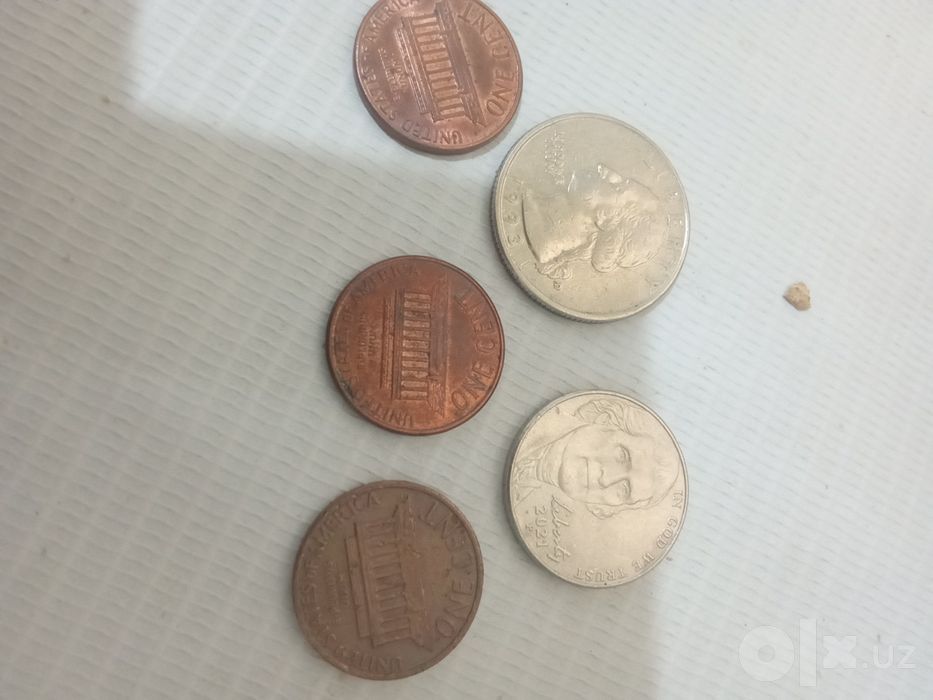 Монеты one cent, five cent и quarter dollar
