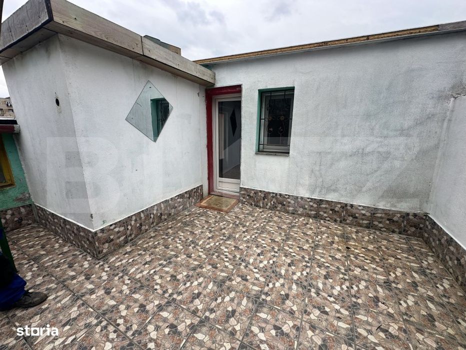Apartament de locuit + atelier auto + terasa si curte generoasa