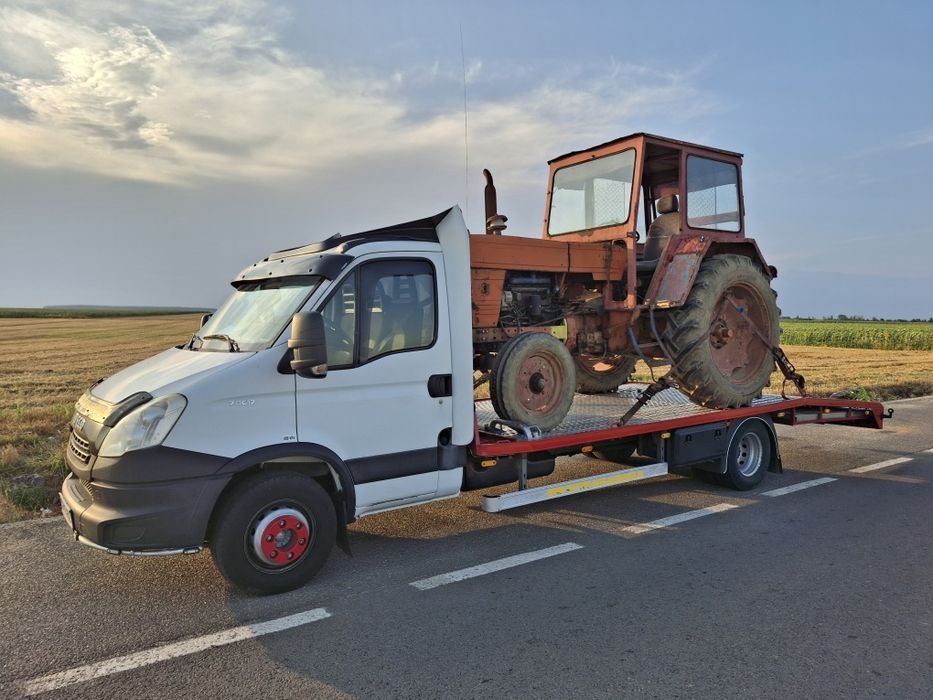 Tractari auto Alexandria si judetul Teleorman Transport Utilaje Tractor Combina Remorca Buldoexcavator Combinator Disc Met Plug