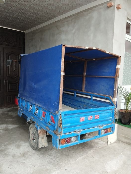 Uch gildirakli skuter