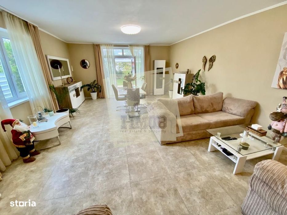 Casa cu 4 camere 3 bai 2 terase si teren 450 mp in zona Parcul Sub Ari