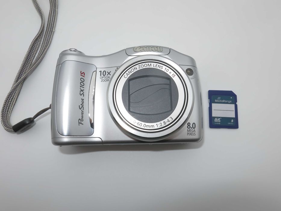 Canon PowerShot SX100 компактен цифров фотоапарат в сребърен цвят, дигитална камера в отлично състояние, 10х оптичен зум, 8MP, тестван работи супер