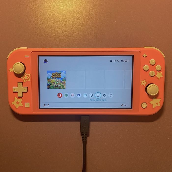 Nintendo switch lite culoare coral nefolosit +jocul animal crossing