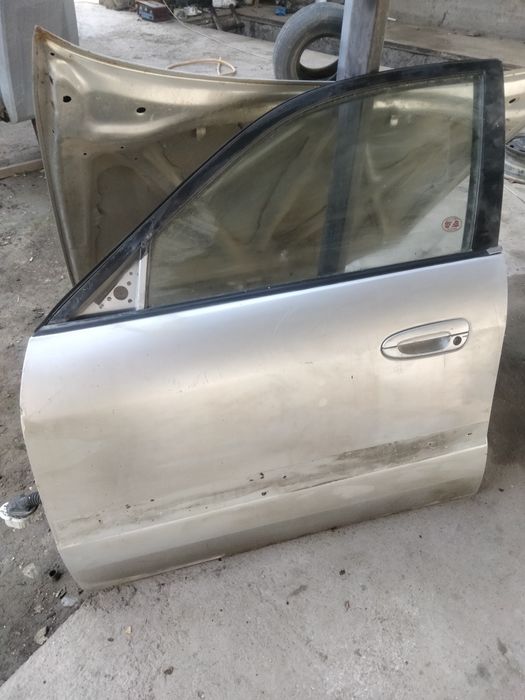Дверь мазда626.птичка.левая.есть шпаклёвка