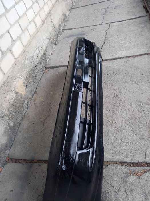 Передний бампер Тойота Карина е.