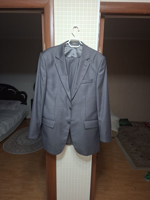 Кастюм с брюками в новам состояний