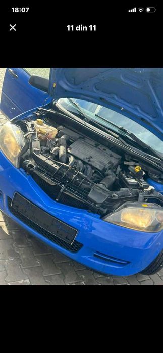 Vand mazda 2 capacitate motor 14