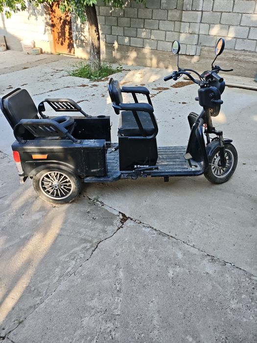 Трицикл бұзылып тұр
