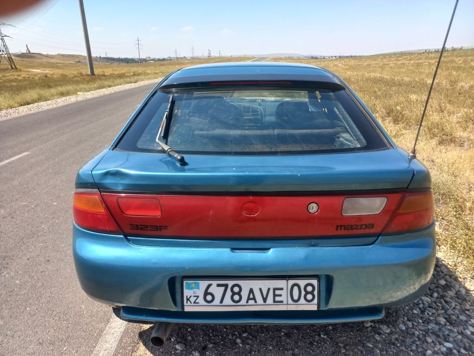 Мазда323F 95г бензин