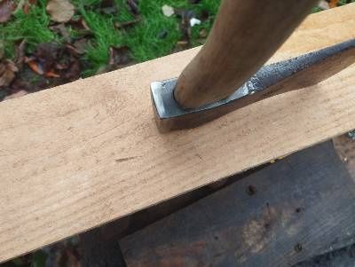 Стара брадва с маркировка