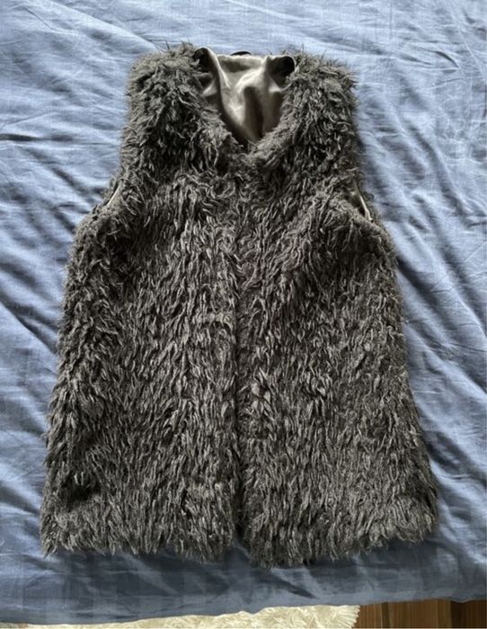 Vesta blana artificiala