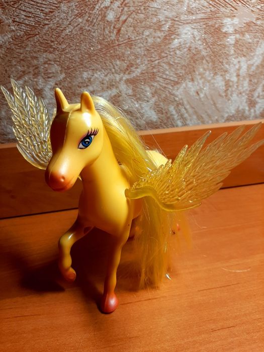 Детская игрушка лошадка