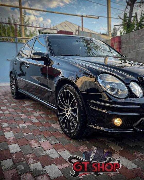 Бампер для Mercedes W211 (E-Class) в стиле AMG 63