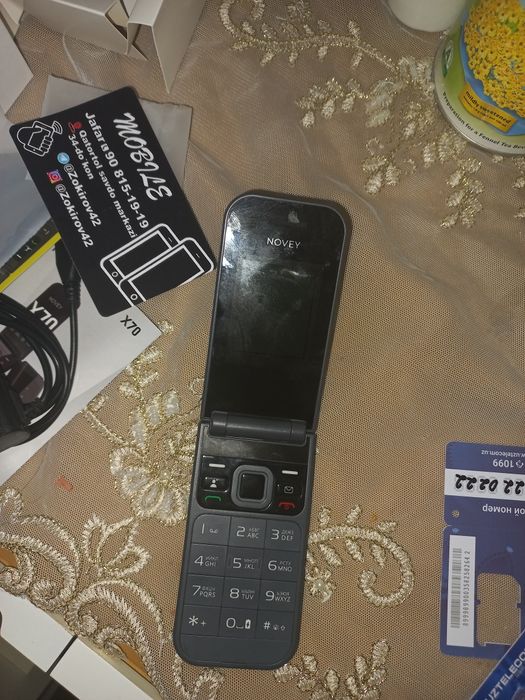 Телефон  НовейХ70