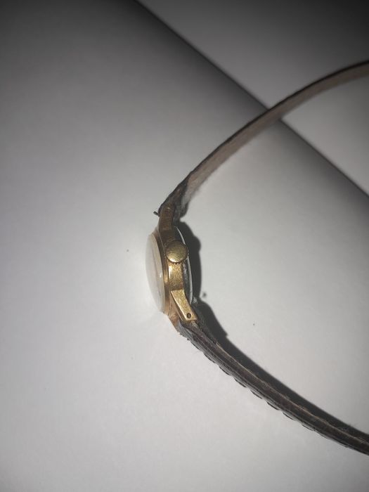 Продам позолоченые часы .