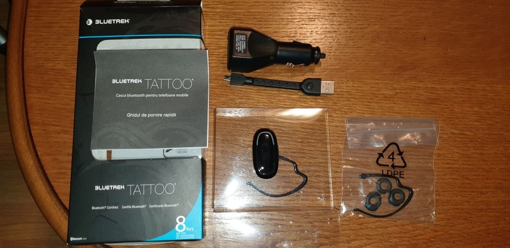 Casca buetooth noua 8 ore de vorbire + incarcator auto 7.7 grame