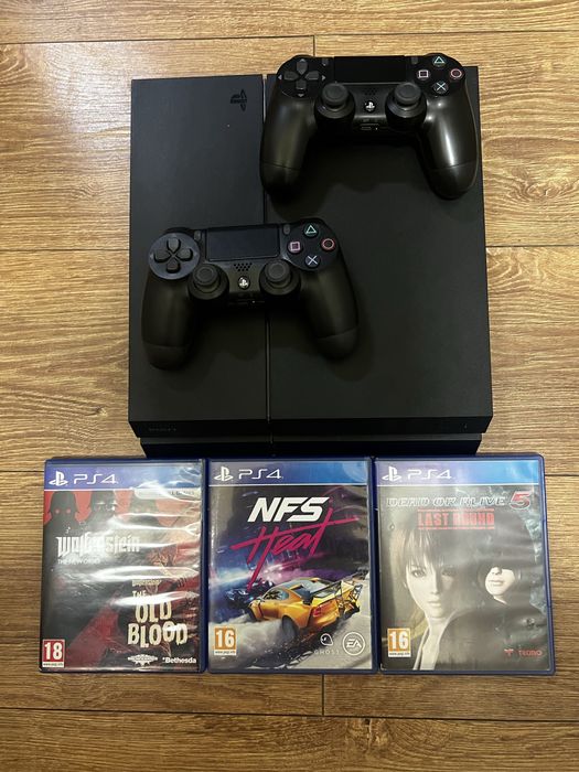 Consolă PlayStation 4 Fat 1TB + 2 Controllere DualShock 4 + 3 Jocuri (NFS Heat, Wolfenstein, DOA5)