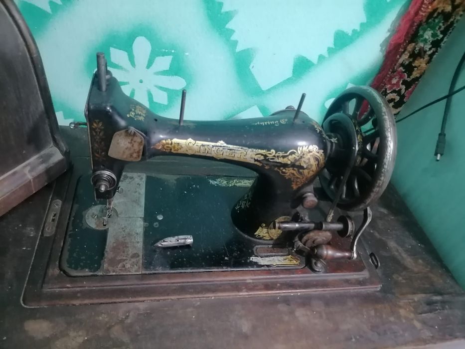 Masina de custut singer