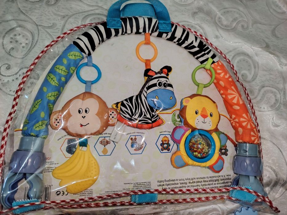 Фирменные игрушки, дуга на коляску