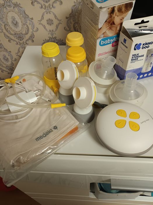 Помпа за кърмене medela swing maxi