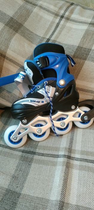Роликовые коньки