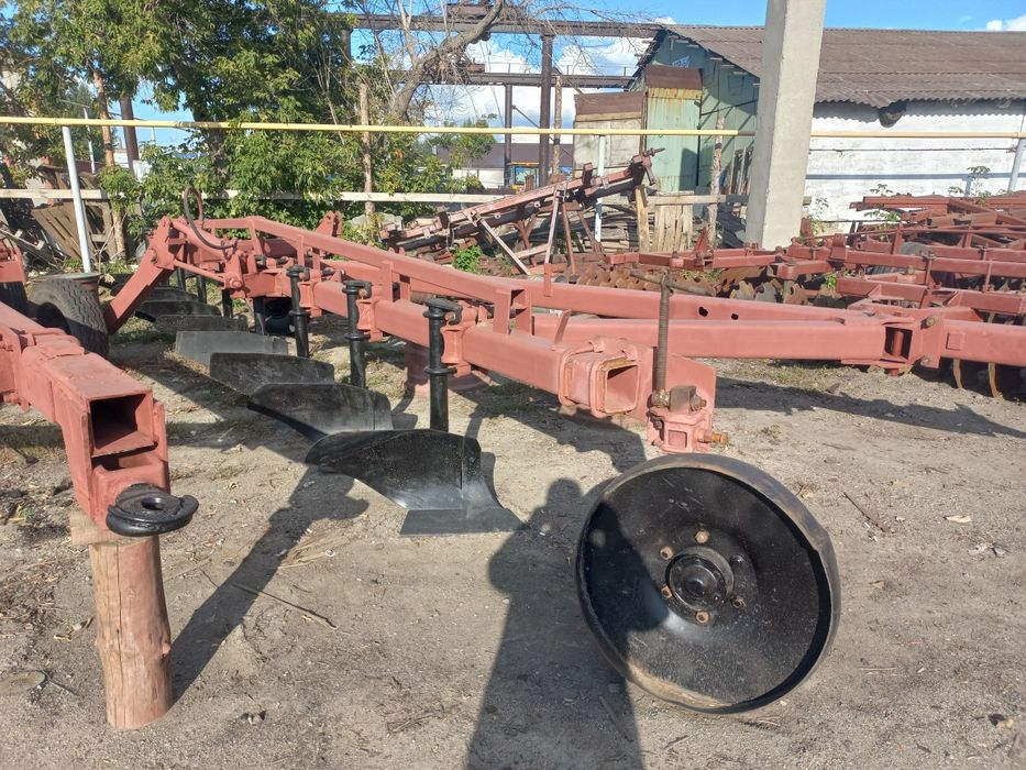 Плуг 9корпусный прицепной