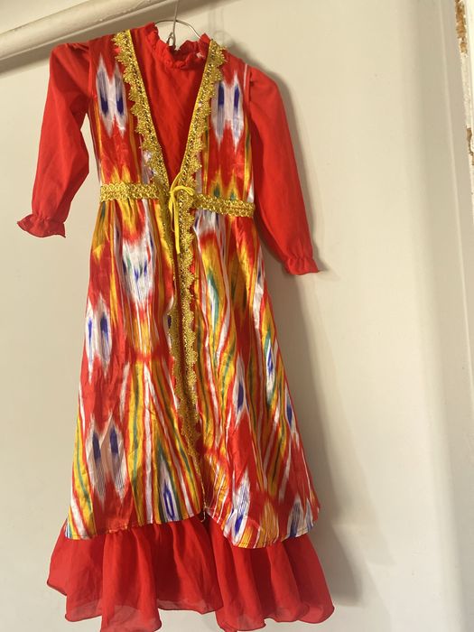 Жилетка бір екірет киілген