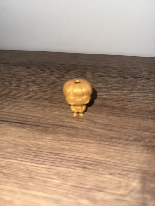 Золотая фигурка Гарри Поттера