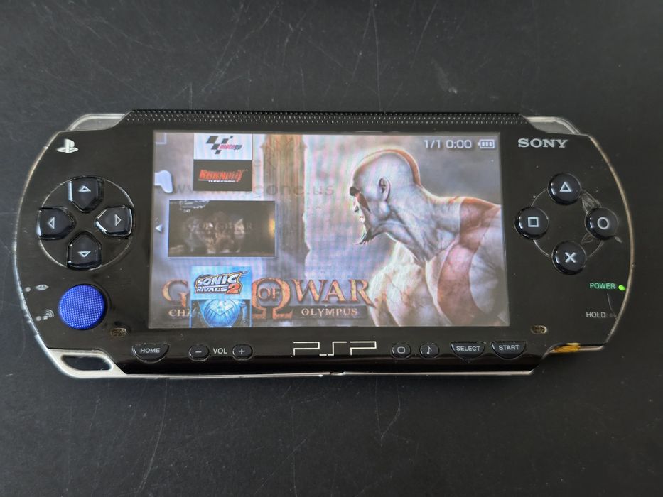 PSP seria 1000 cu încărcător și modat 32 gb