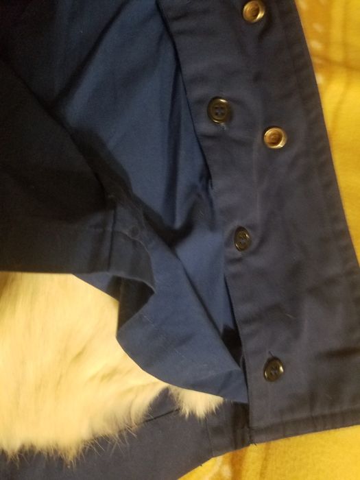 Детский плащ с отстегивающей подкладкой из натурального меха.