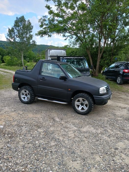 Suzuki Grand Vitara sau schimb cu mașina de teren cu bena
