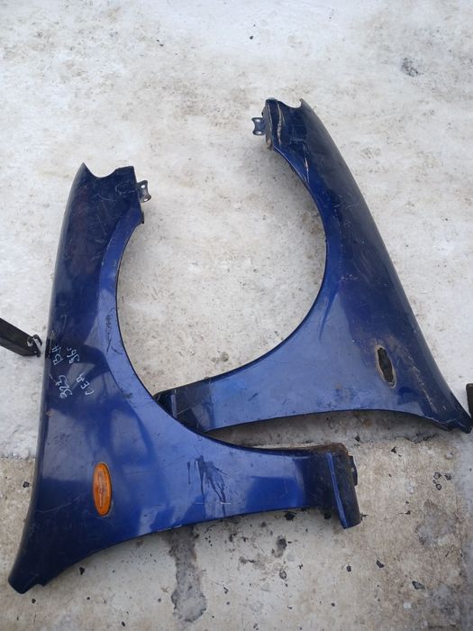 Крыло Мазда 323 седан 1996г в оригинале