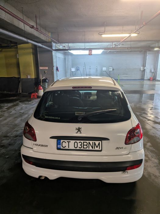 Peugeot 206+ aer conditionat ,geamuri electrice fata