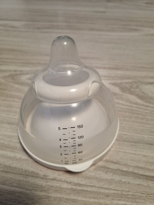 Бебешка бутилка със затопляща купа