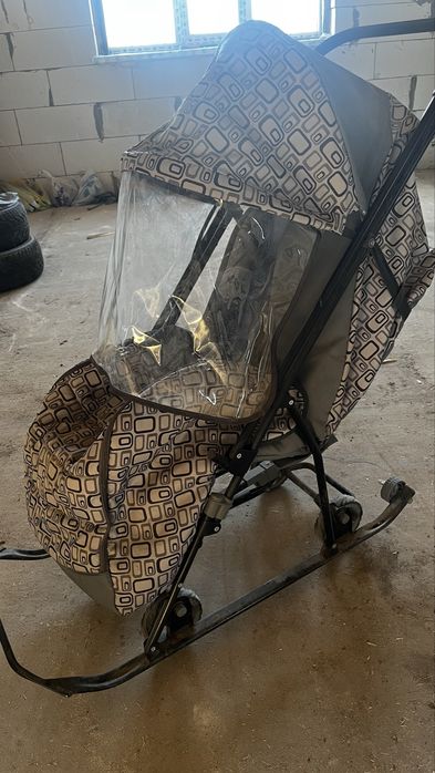 санки-коляска на колесах