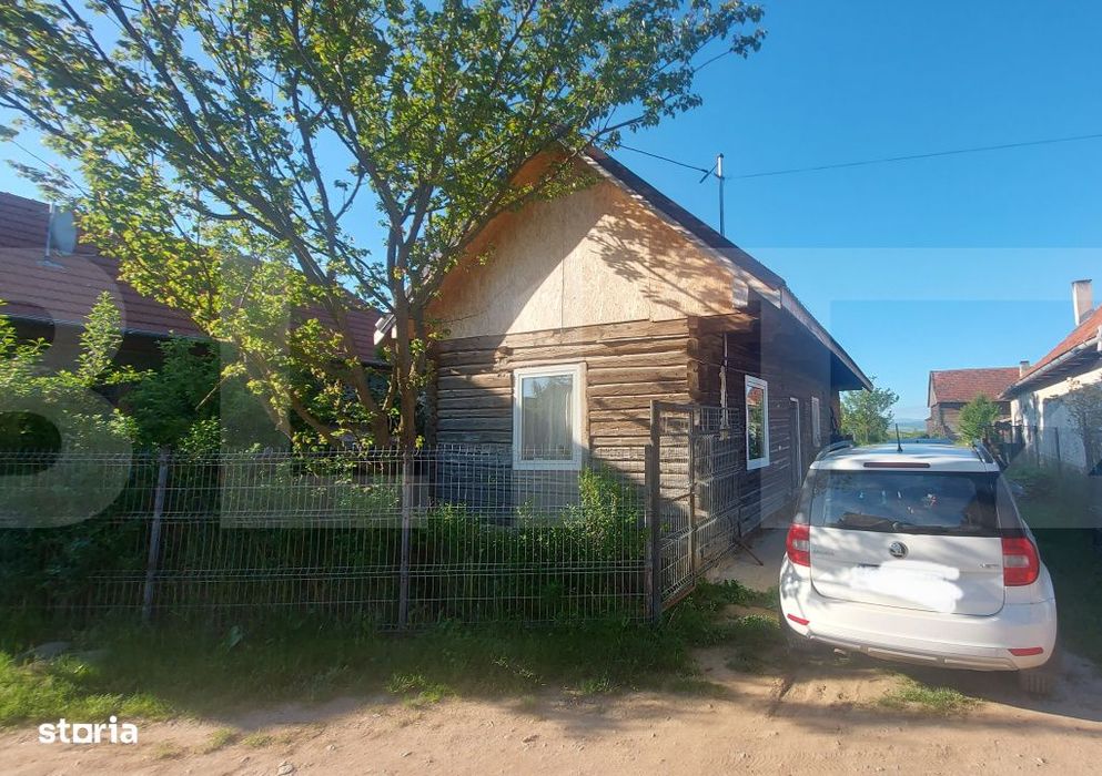 Casa cocheta din lemn masiv cu teren si livada – liniste, natura si