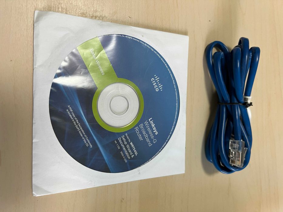 Vand router wireless Linksys RT54GL + cablu de retea+CD instalare