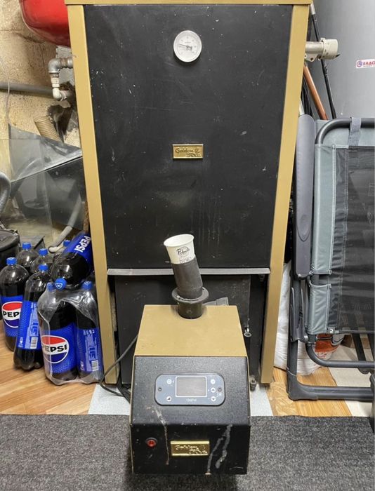 Котел с радиатори на пилети и дърва