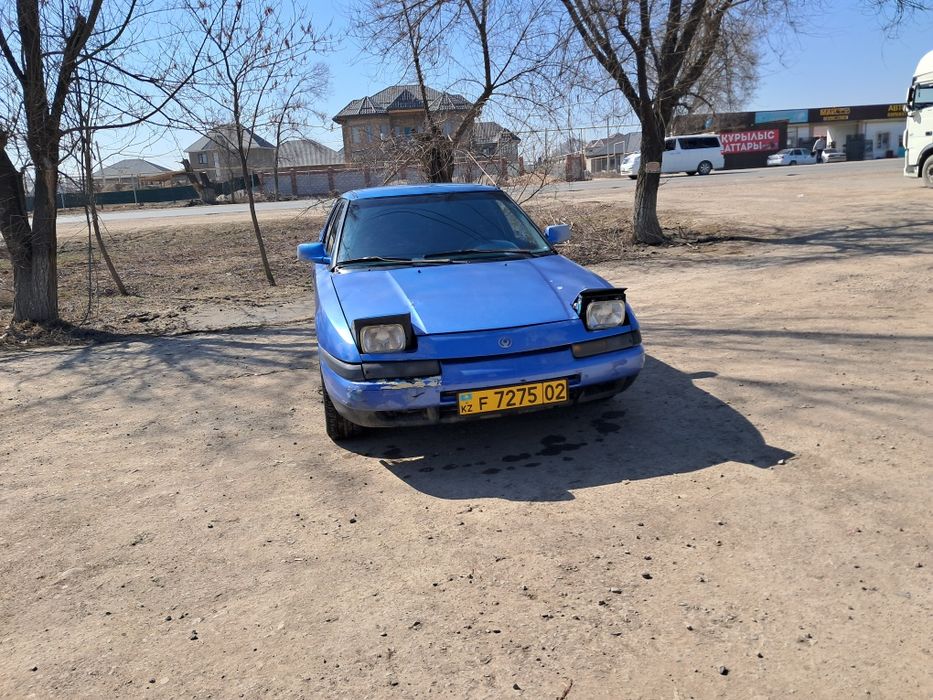 Машина мазда 323