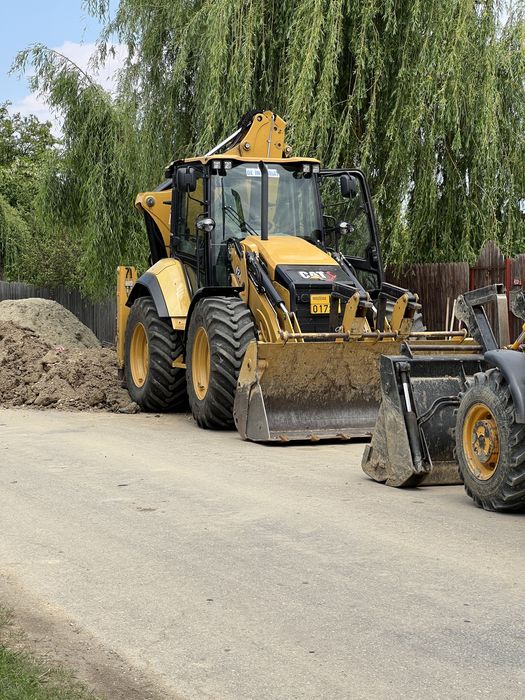 Inchiriere  buldoexcavator Caterpillar 434 roti egale
