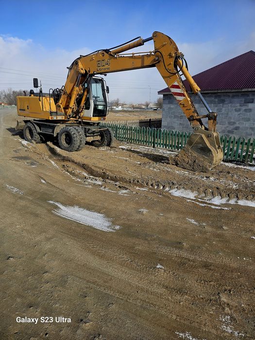 Продам колёсный экскаватор.
