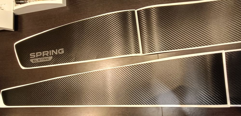 Bandouri laterale compatibile Dacia Spring carbon/negru mat texturat