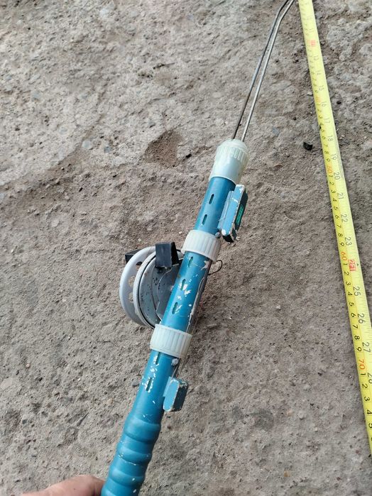 Зимний спининг с катушкой.