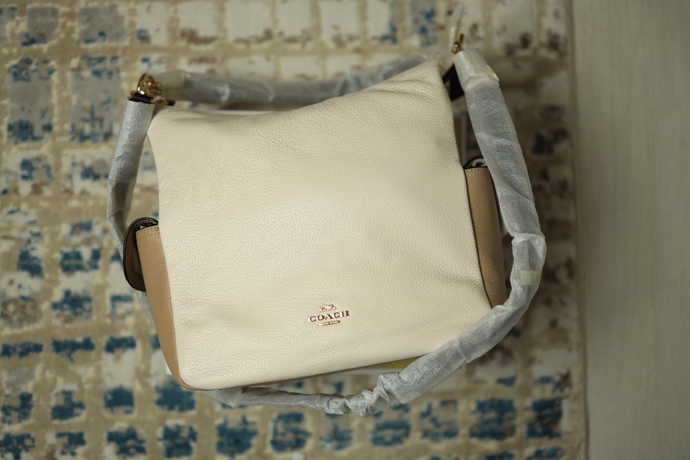 Продам новую кожанную сумку Coach