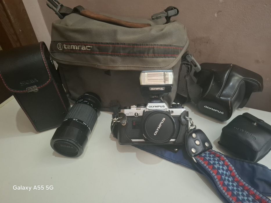 Titlu: Kit Complet Aparat Foto Film Olympus OM-10 + Obiective + Bliț
Descriere